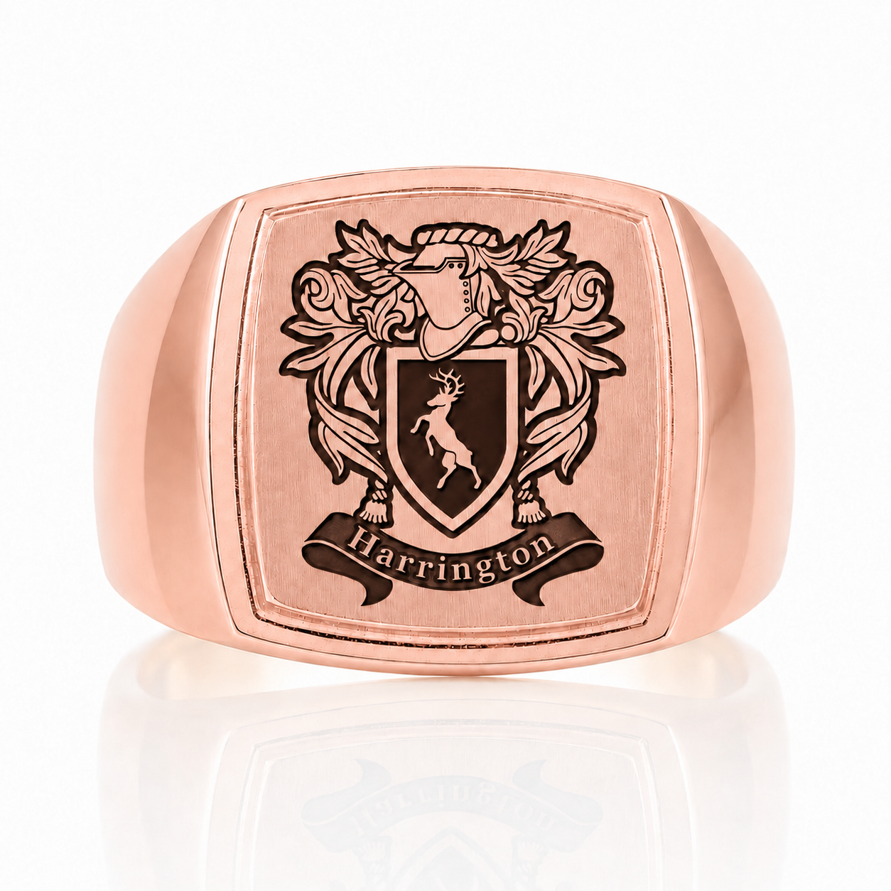 A rose gold ring with a square crest featuring a shield with a lion and the word "Harrington" below it.
