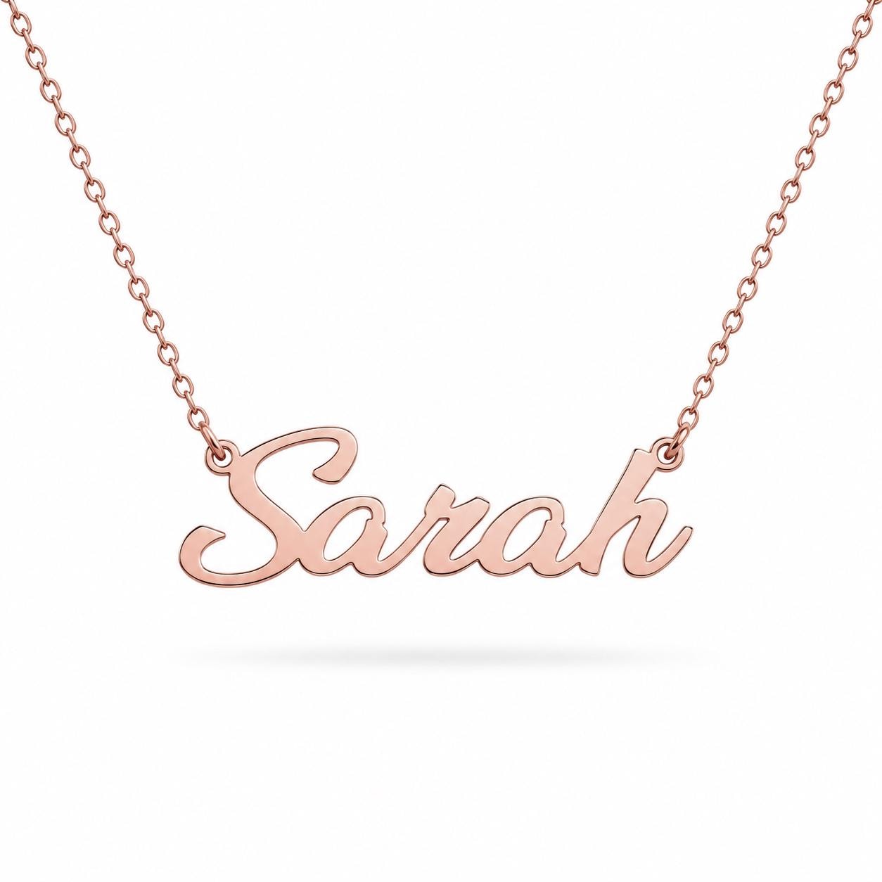 A necklace with the name "Sara" engraved on it.