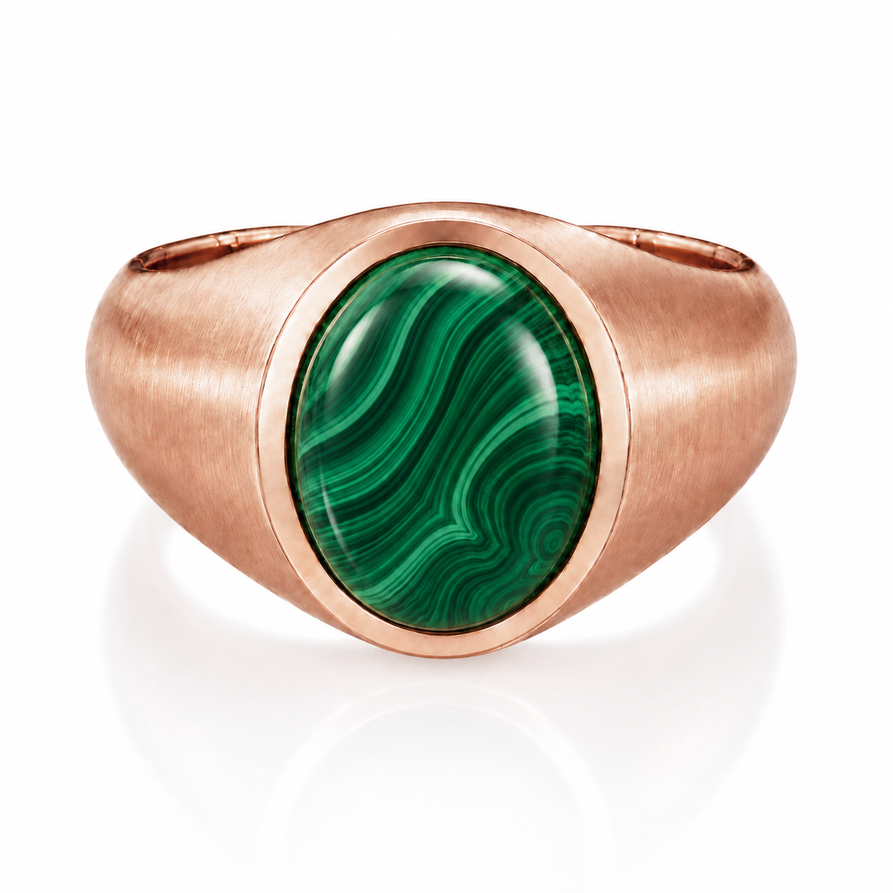 A copper-colored ring with a large oval-shaped green gemstone in the center.