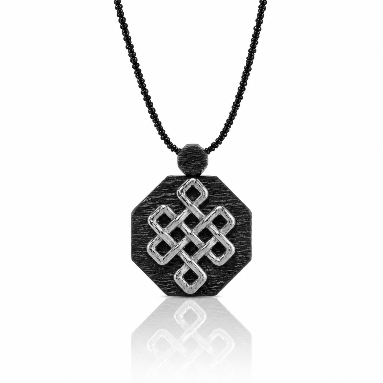 A black and silver necklace with a pendant featuring a geometric design.