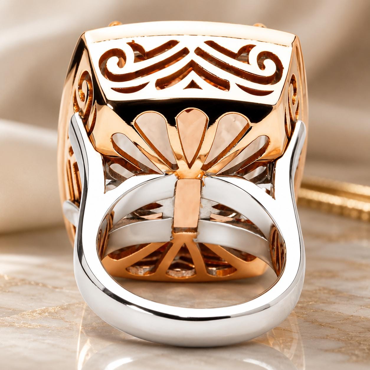A close-up view of a large, ornate ring with intricate designs and patterns, showcasing the craftsmanship and details of the jewelry piece.