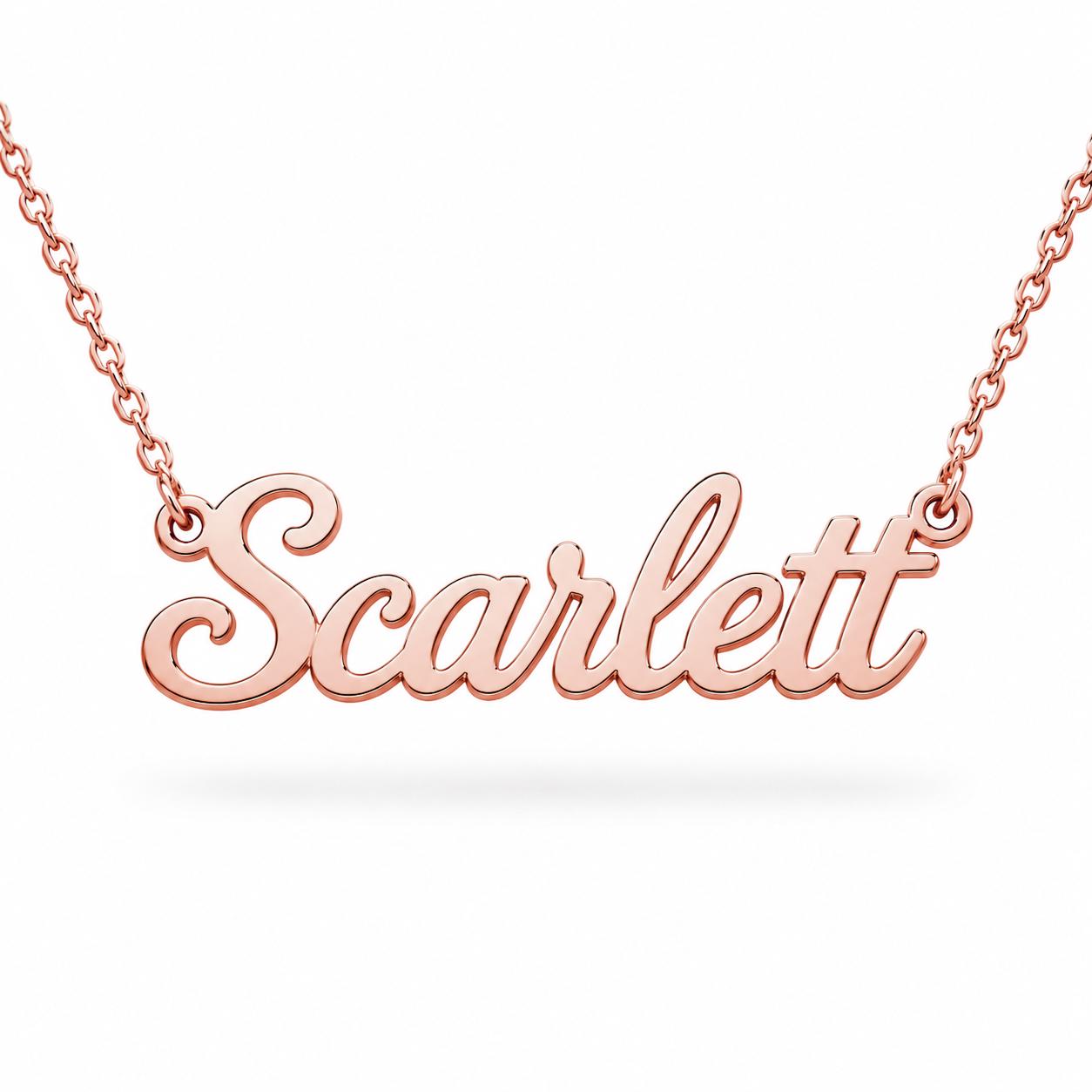 A necklace with the name "Scarflet" engraved on it.