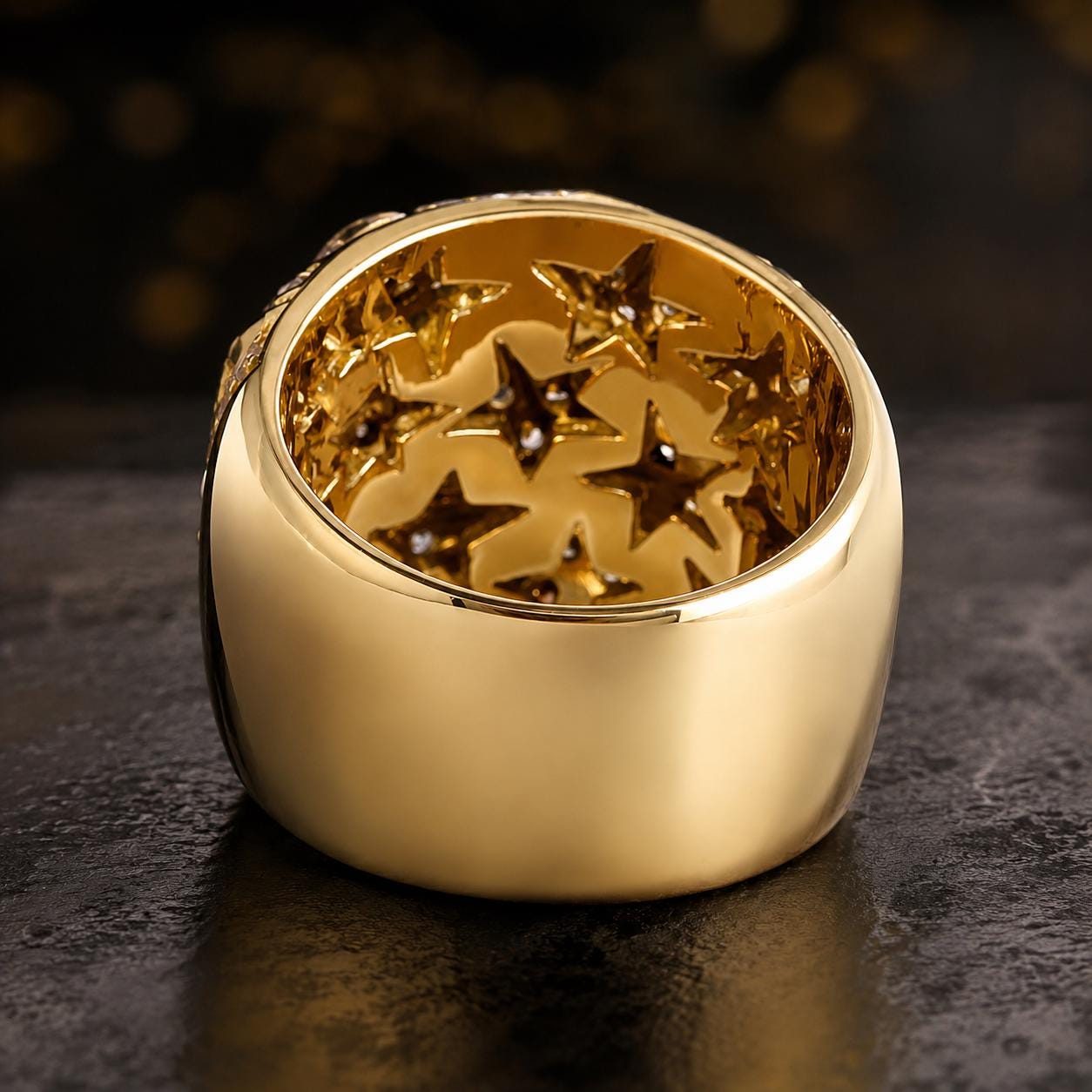 A gold ring with a large central hole, through which numerous small gold stars are visible.