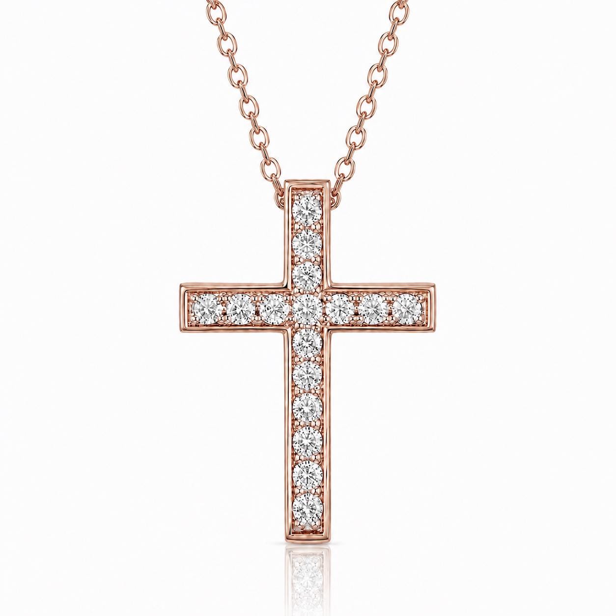 A rose gold cross necklace with small diamonds set in the center.