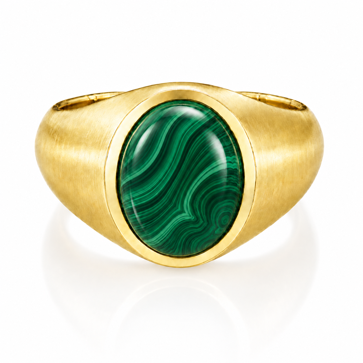 A gold ring with a large oval-shaped gemstone in the center.