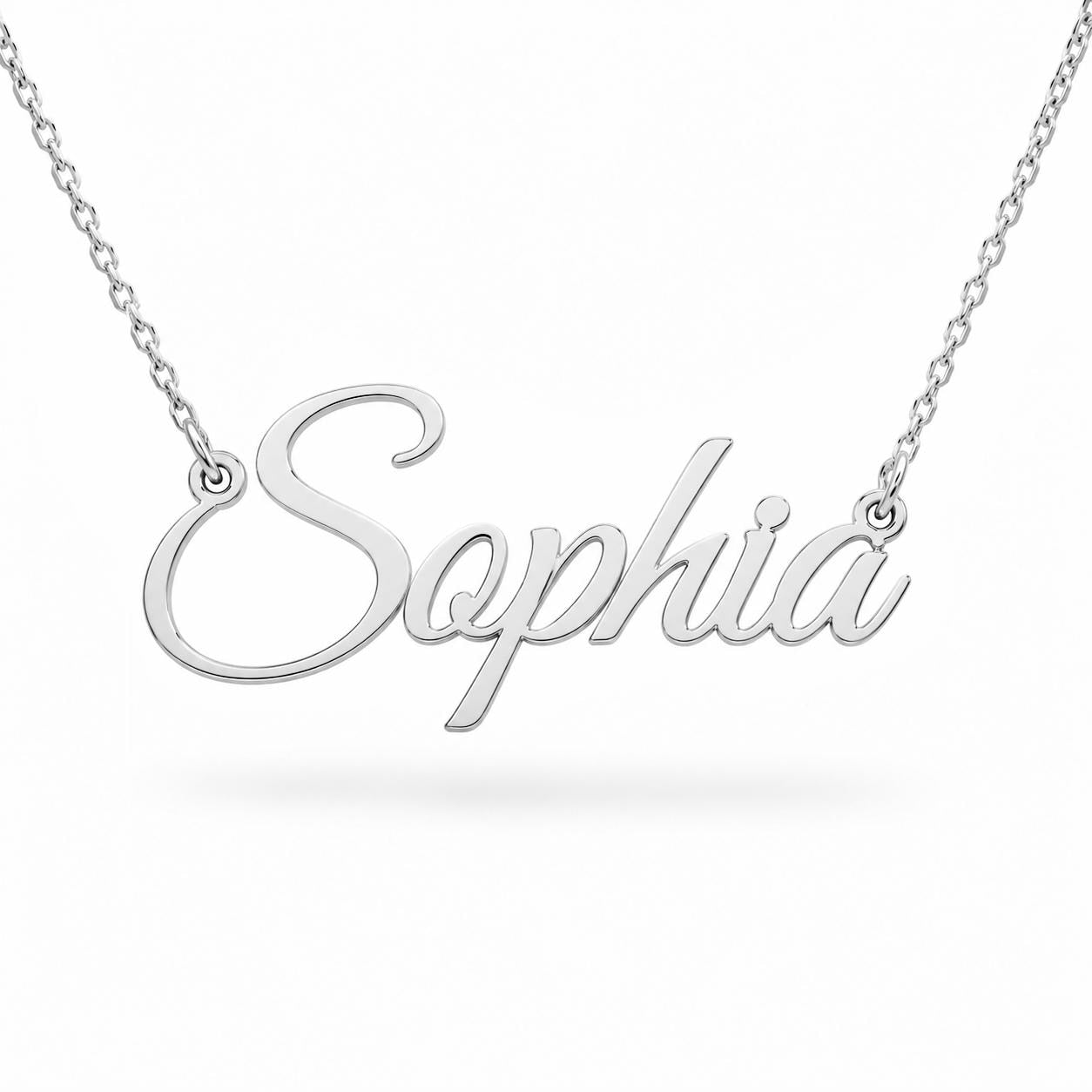 A silver necklace with the word "Sophia" engraved on it.