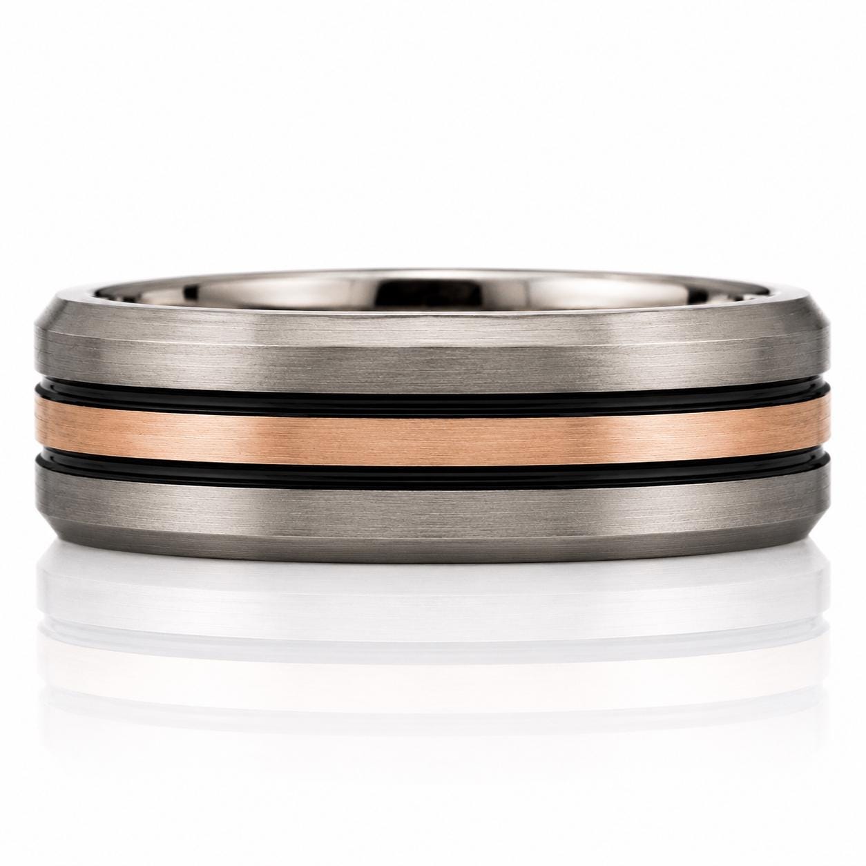 A silver ring with a horizontal band of copper-colored metal.