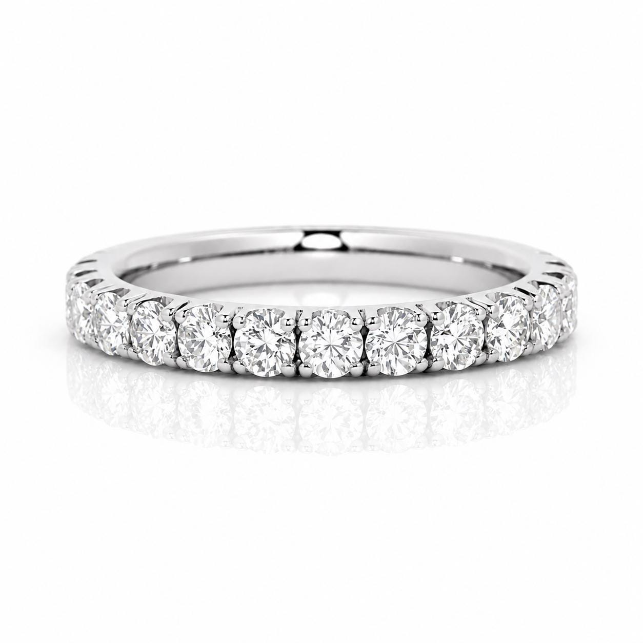 A silver band with a row of round diamonds set in it.