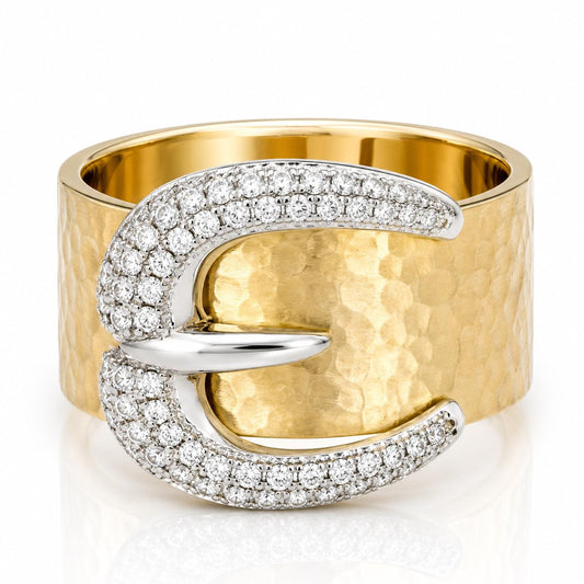 A gold ring with a large diamond-encrusted buckle-shaped design.