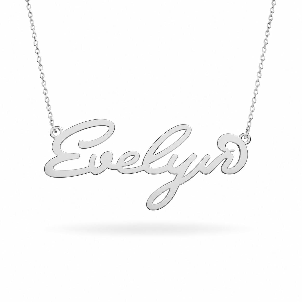 A silver necklace with the name "Evelyn" engraved on it.