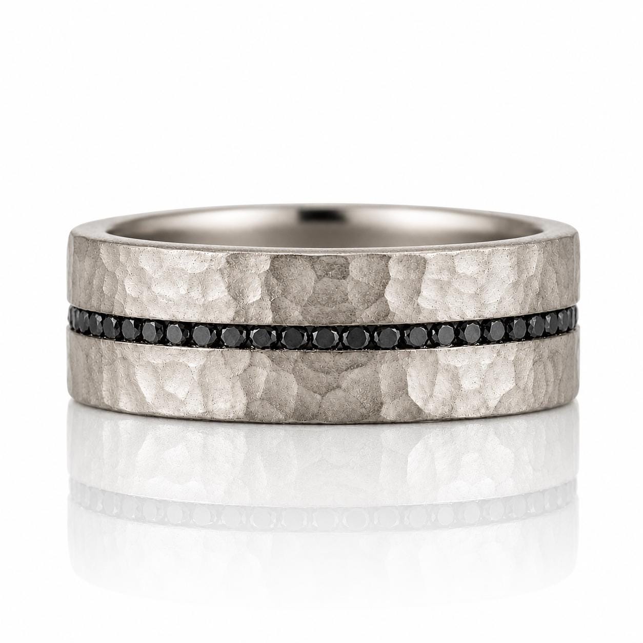 A silver-toned ring with a horizontal band of black diamonds set in the center.