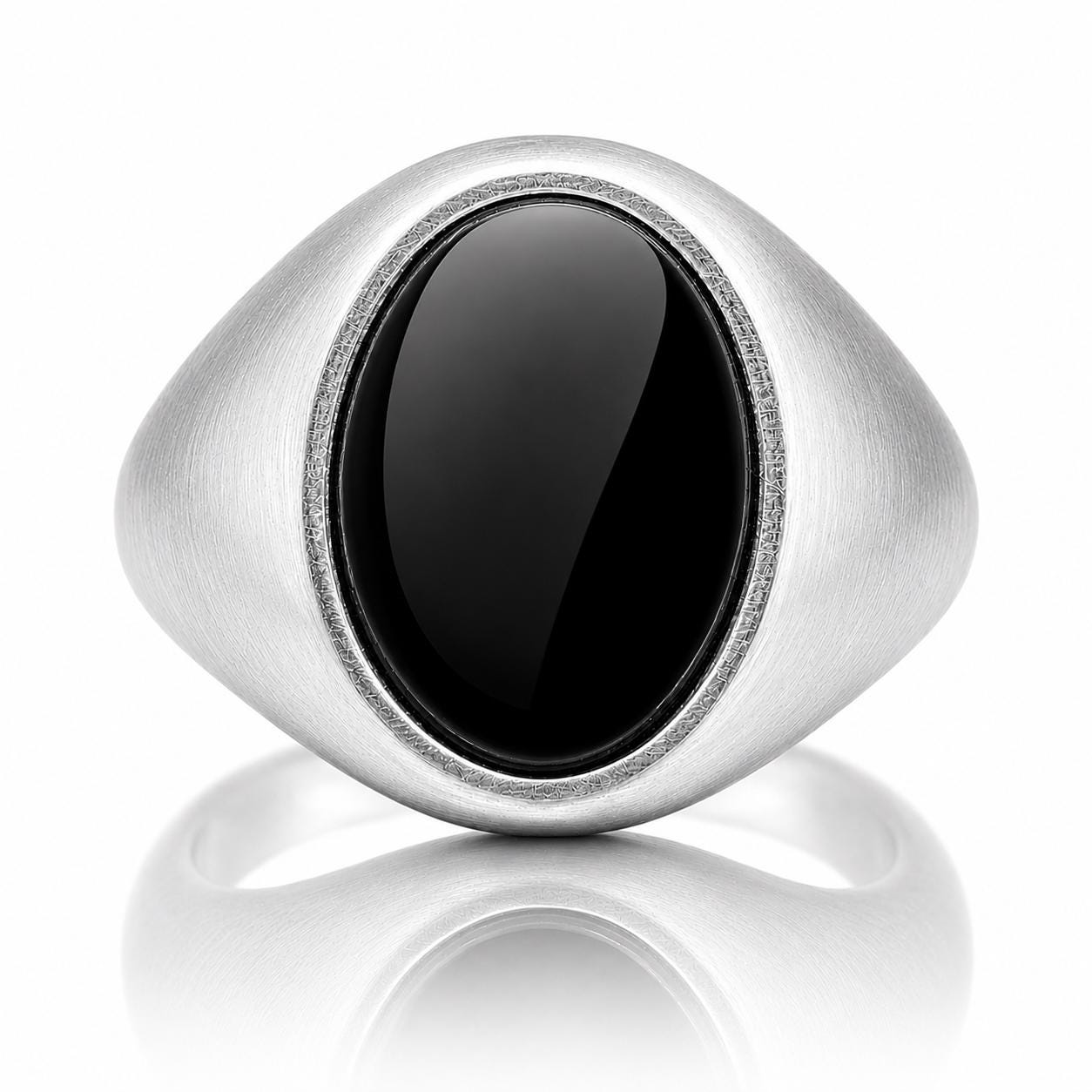 A silver ring with a large oval-shaped black stone in the center.
