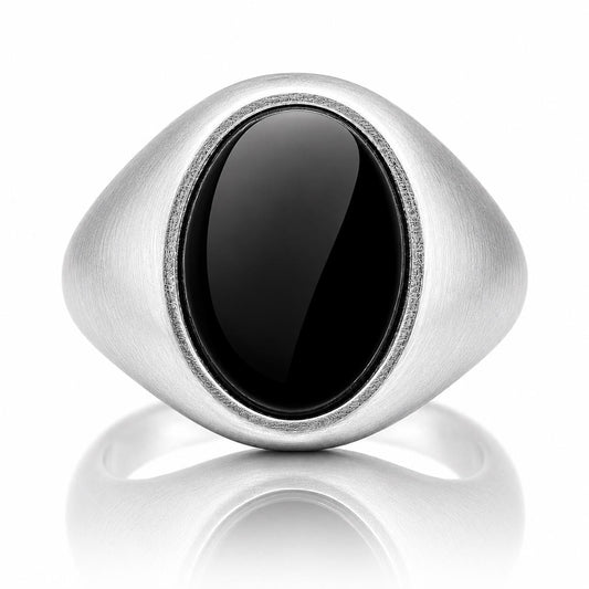 A silver ring with a large oval-shaped black stone in the center.