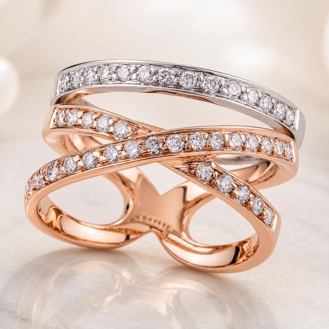A close-up image of a ring with a combination of gold and silver bands adorned with small diamonds.