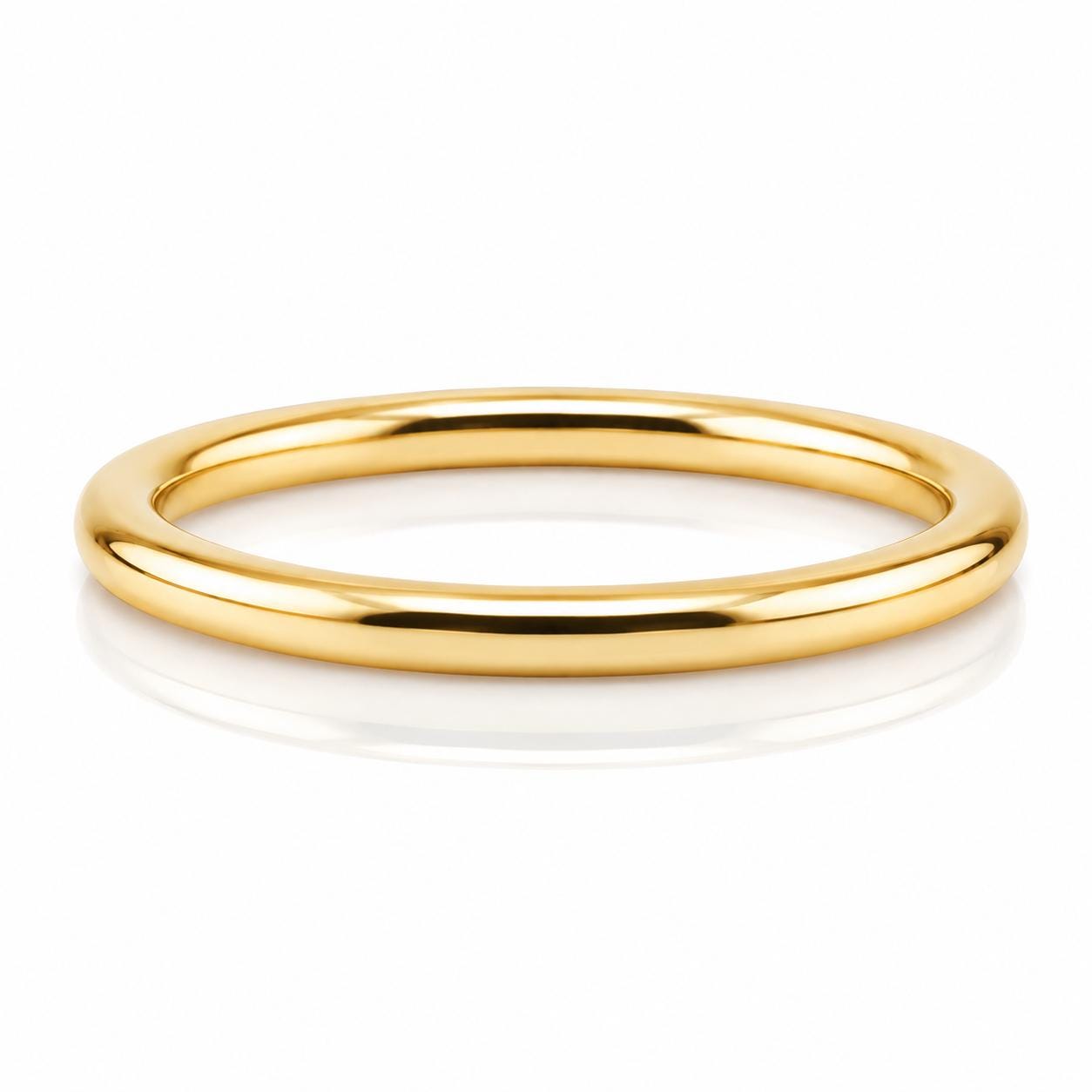 A shiny gold ring is shown against a white background.
