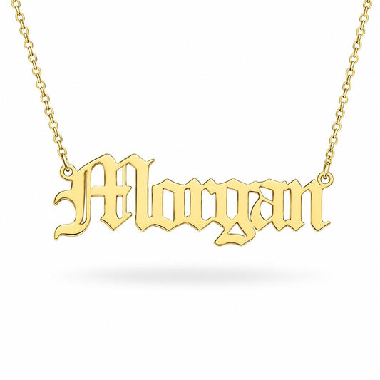 A gold-colored necklace with the name "Morgan" engraved on it.
