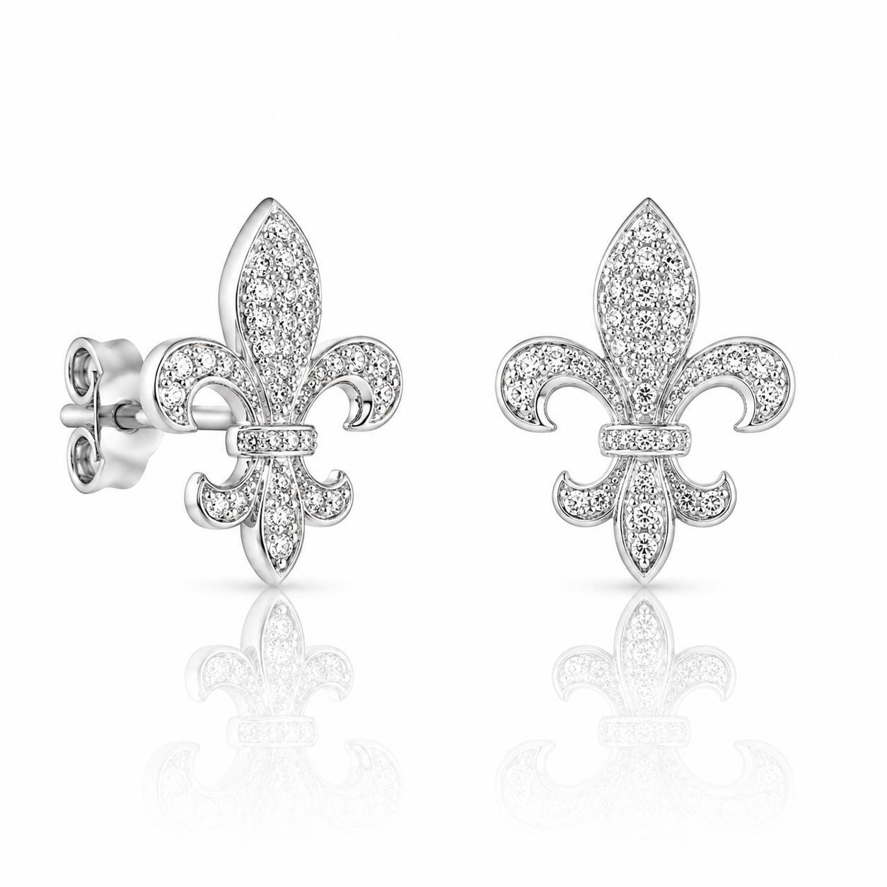 A pair of silver earrings with small diamonds on top, shaped like fleur-de-lis flowers.