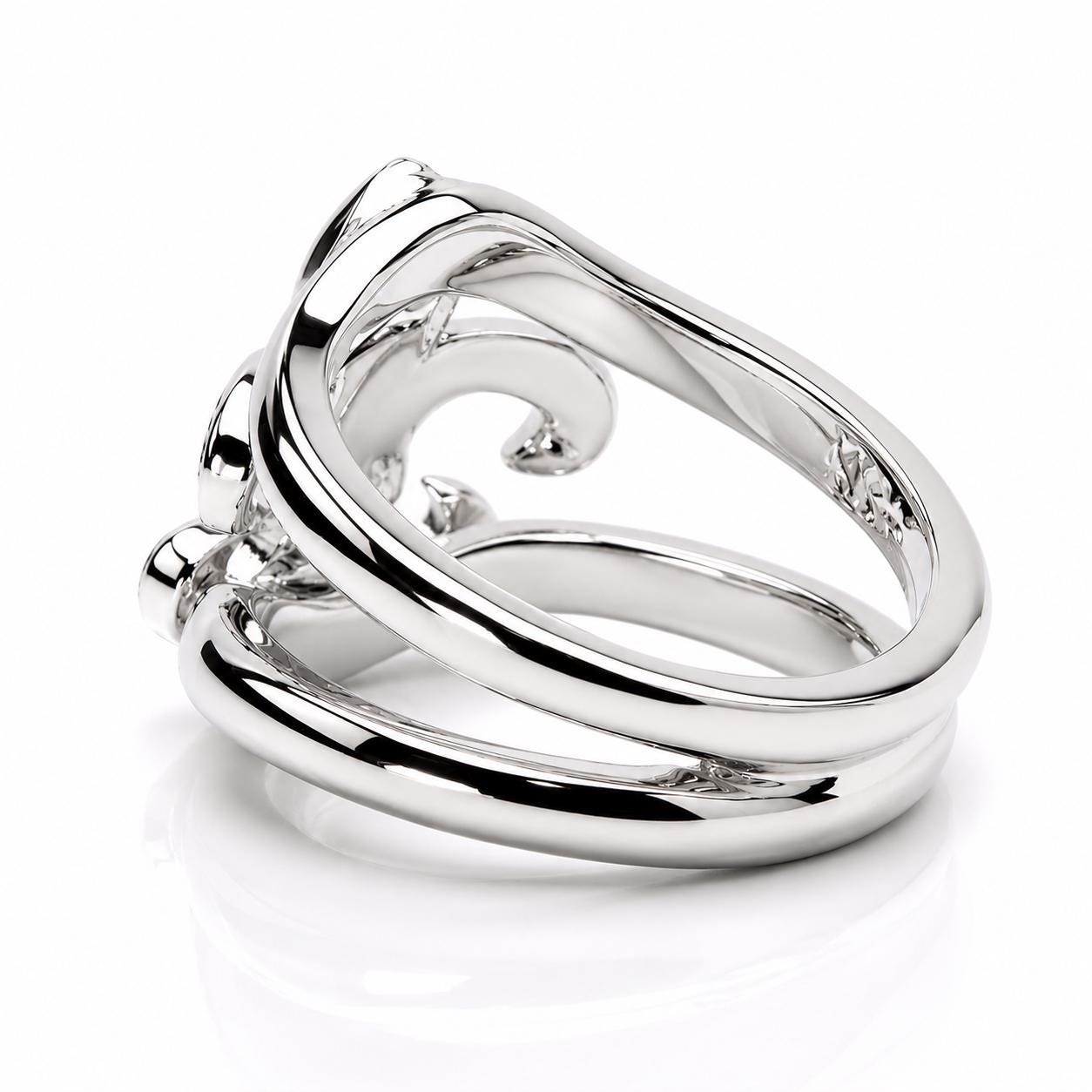 A silver ring with a unique, intricate design.