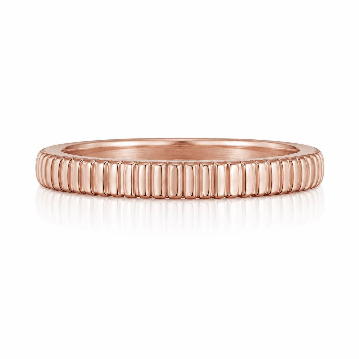 A rose gold band with a row of small, evenly spaced lines along its surface.