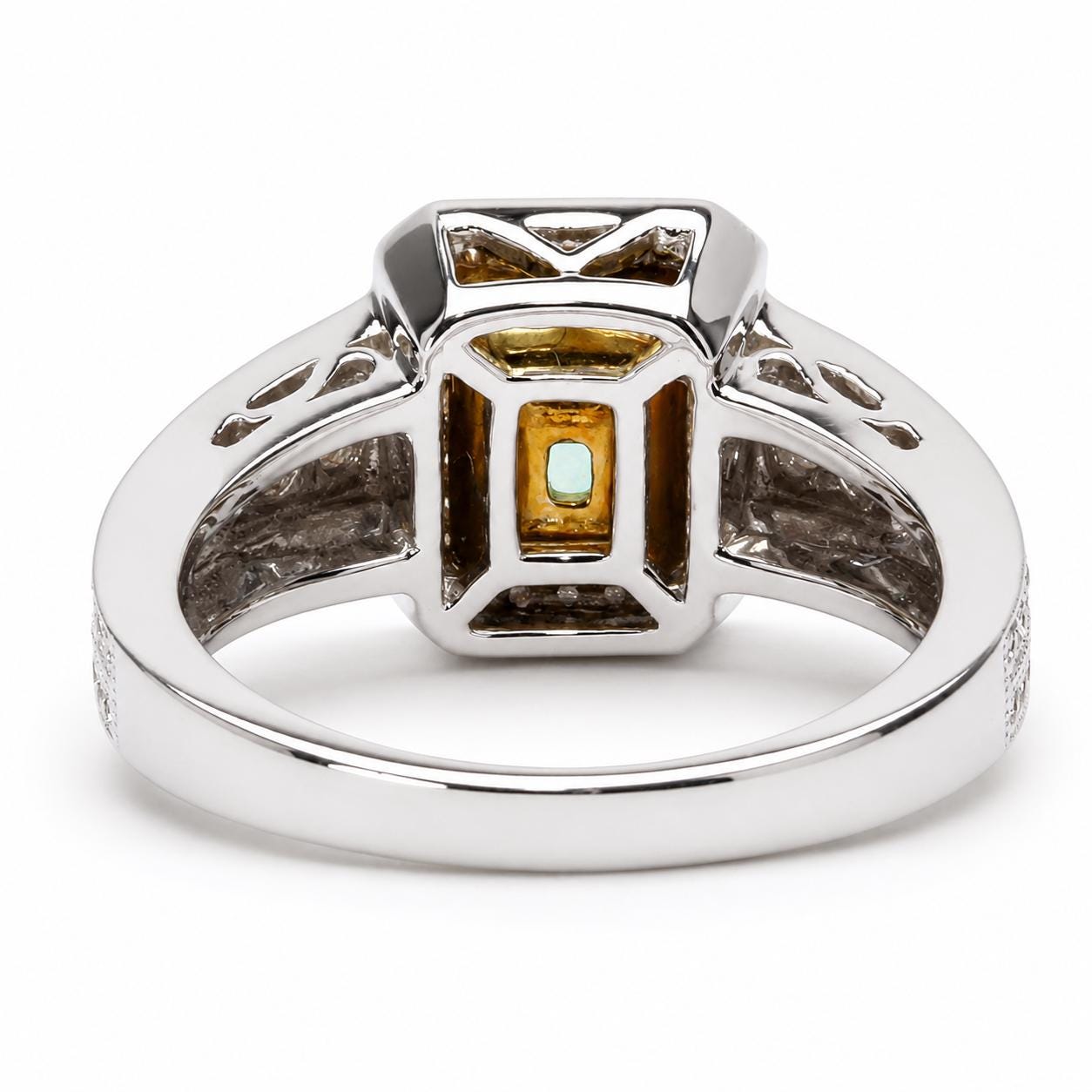 A silver ring with a large, square-shaped gemstone in the center.