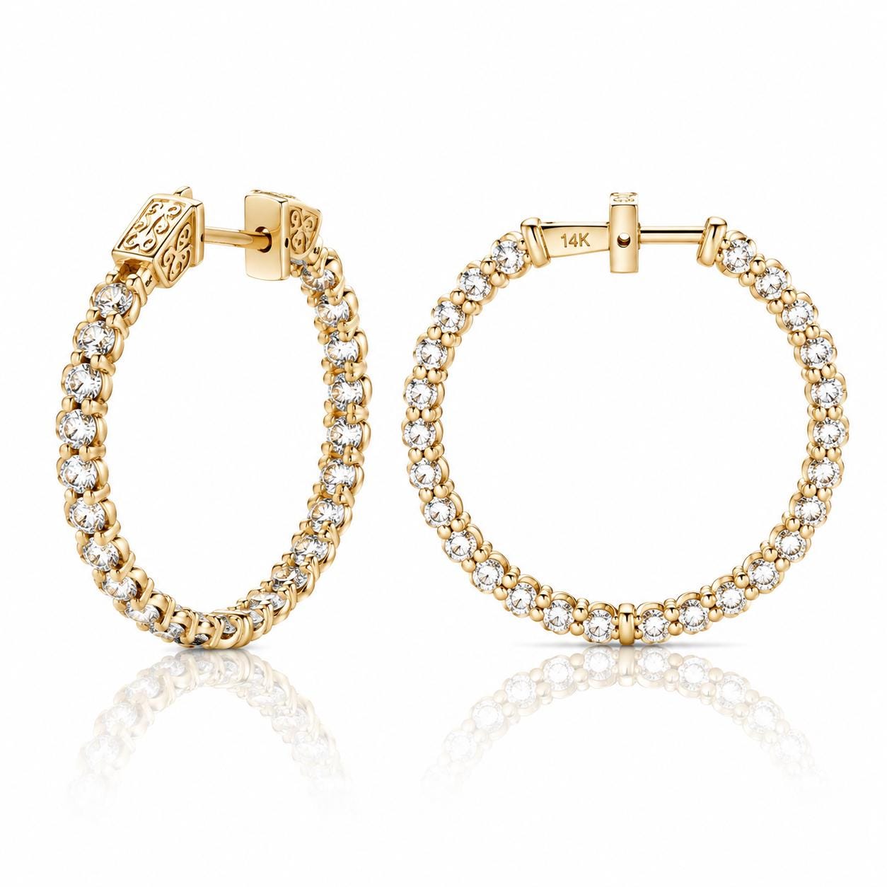 a pair of gold hoop earrings with a row of small diamonds set in the center.