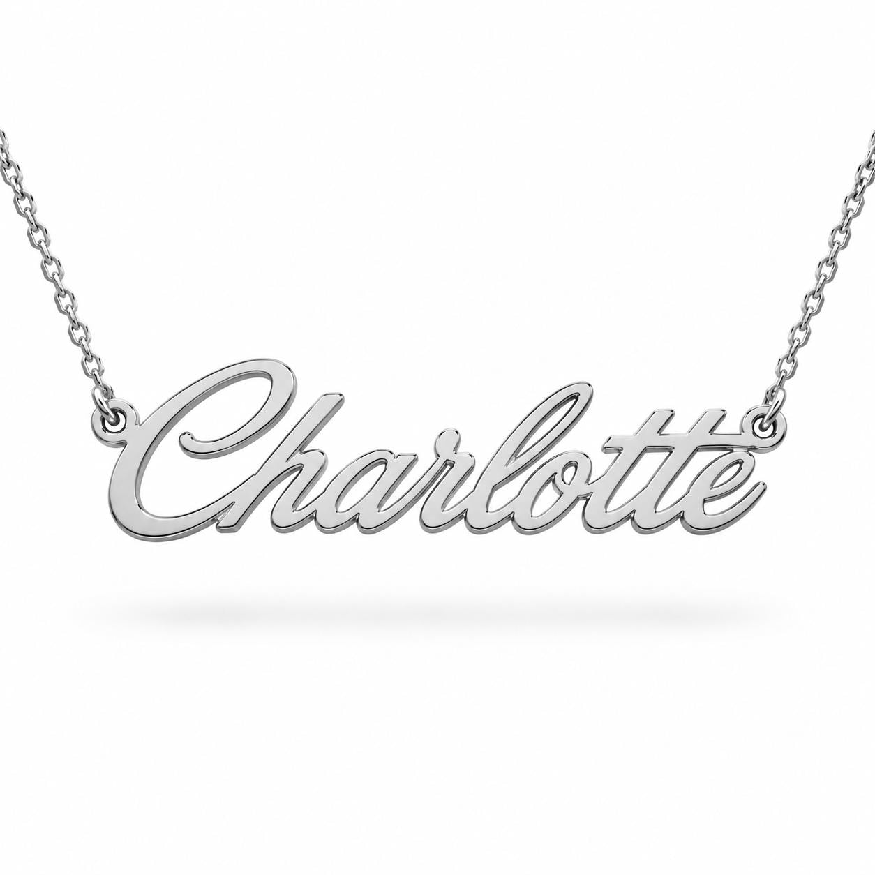 A necklace with the name "Charlotte" engraved on it.