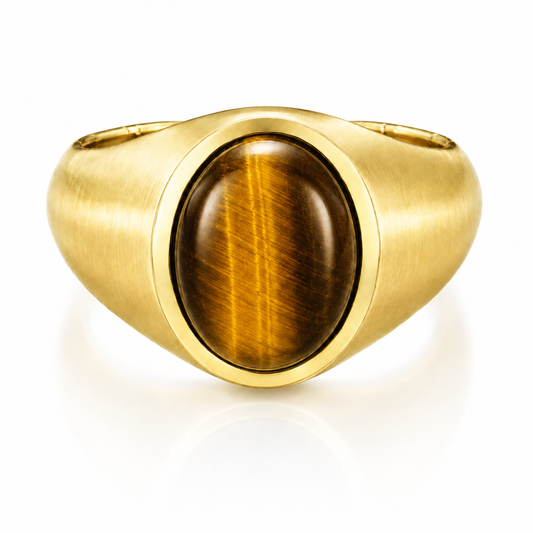 A gold ring with a large, round, amber-colored gemstone in the center.