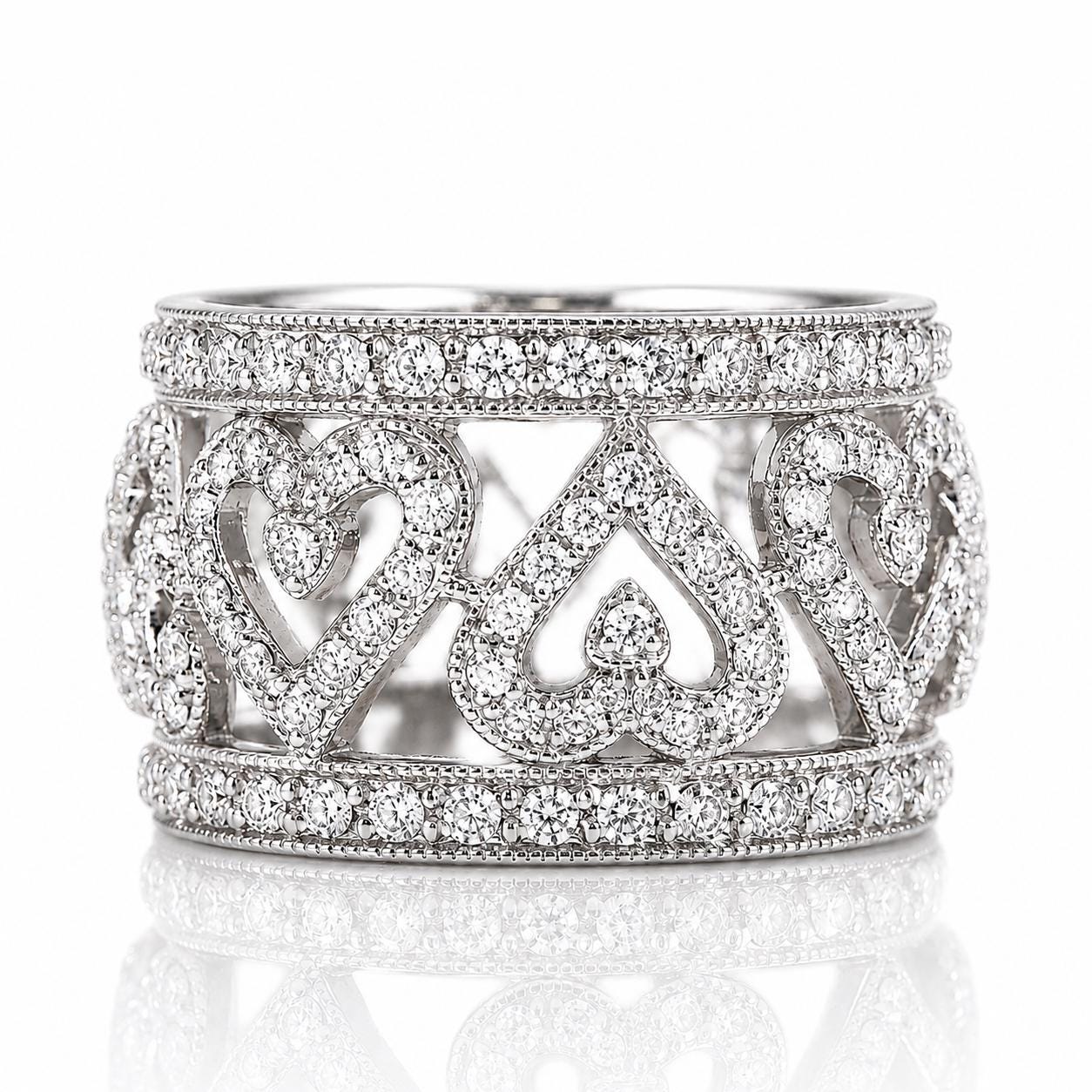 A silver ring adorned with numerous sparkling diamonds, featuring a heart-shaped design.