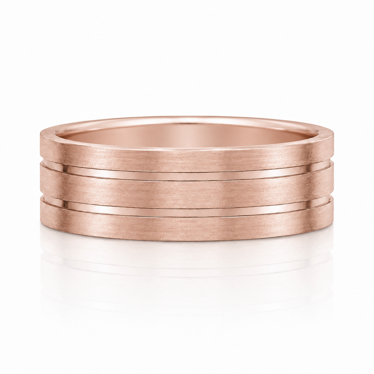 A rose gold ring with three concentric bands, showcasing a subtle texture and a classic design.