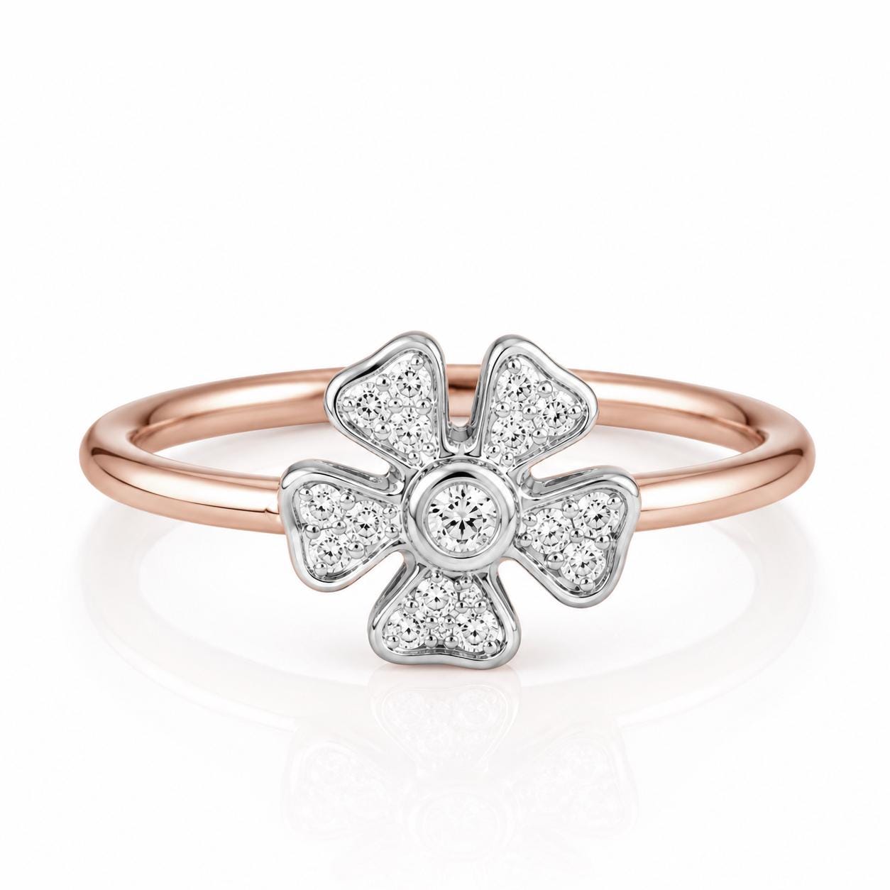 A rose gold ring with a large diamond center stone surrounded by smaller diamonds.