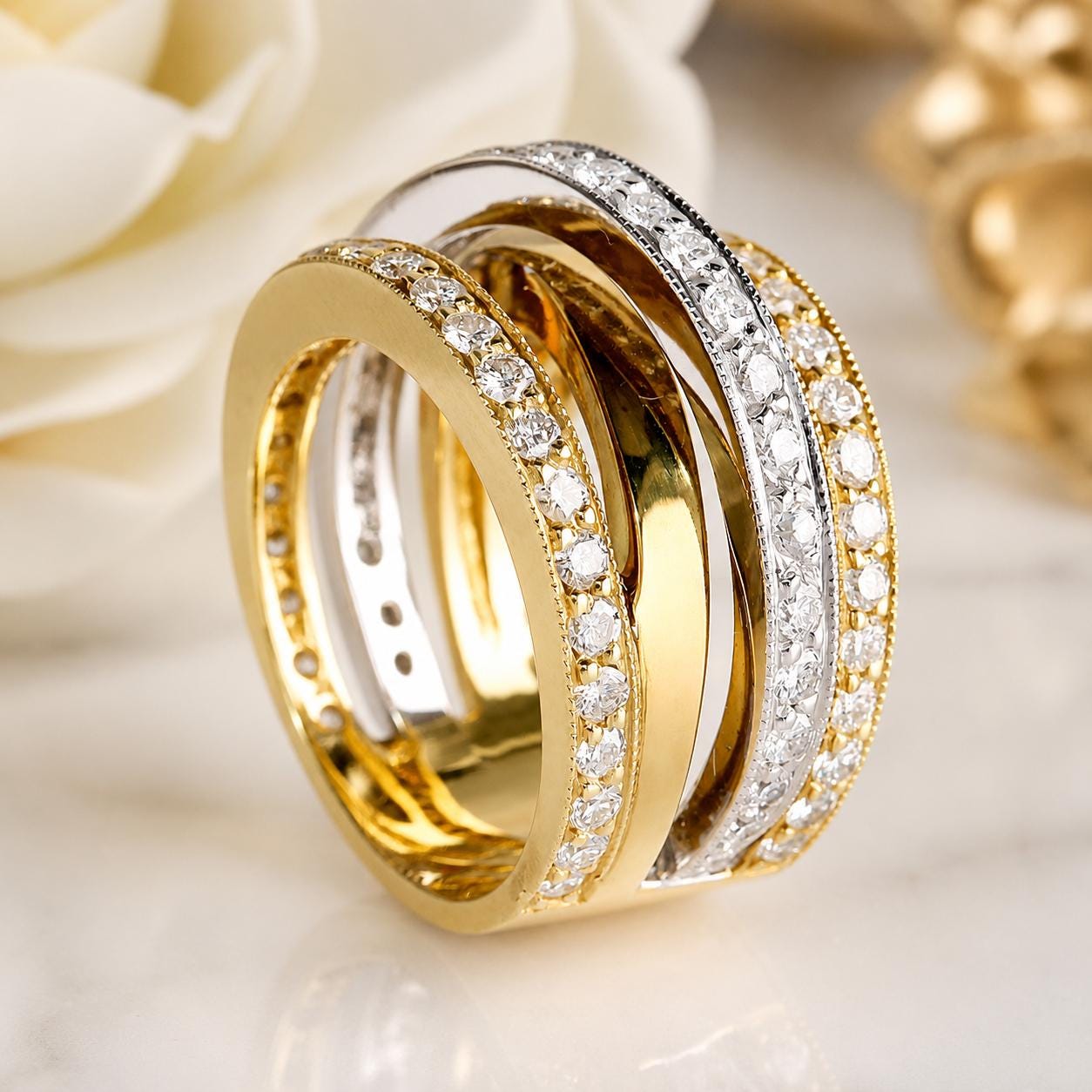 A close-up image of a gold ring with a diamond band, showcasing the intricate design and sparkling diamonds.