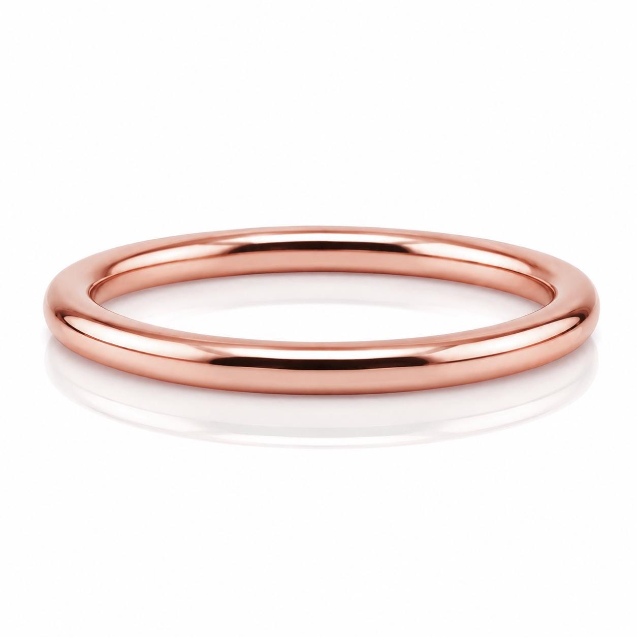 A shiny, copper-colored ring is shown against a white background.