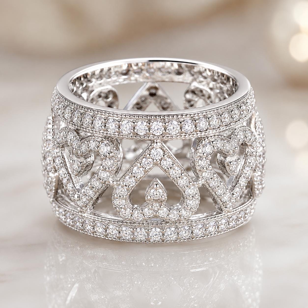 A stunning diamond ring with a large central diamond surrounded by smaller diamonds arranged in a circular pattern, creating a beautiful, intricate design.