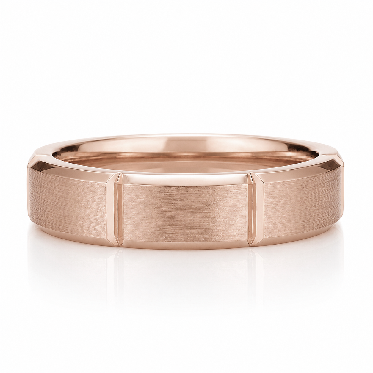 A rose gold ring with a textured band design.