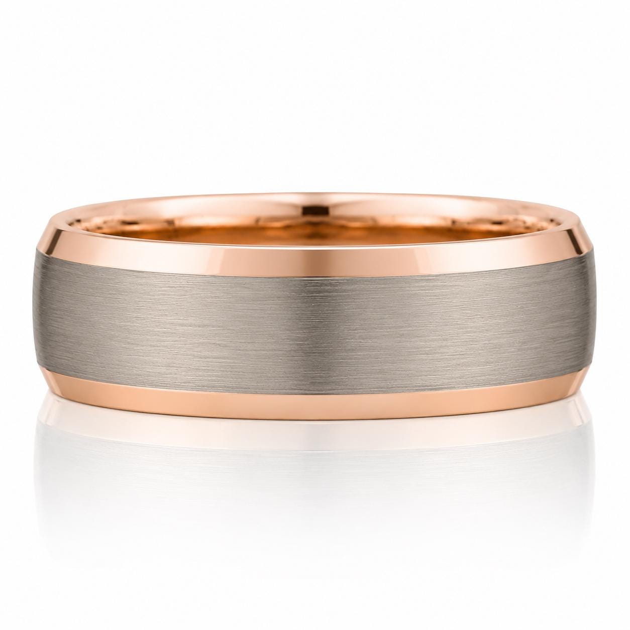 A rose gold ring with a silver band, showcasing its intricate design and elegant appearance.