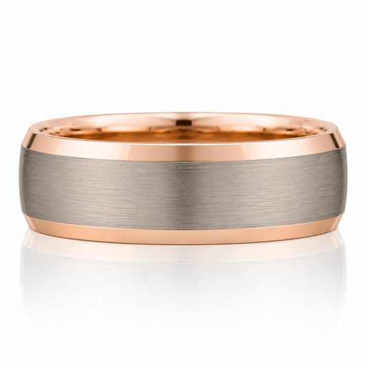 A rose gold ring with a silver band, showcasing its intricate design and elegant appearance.