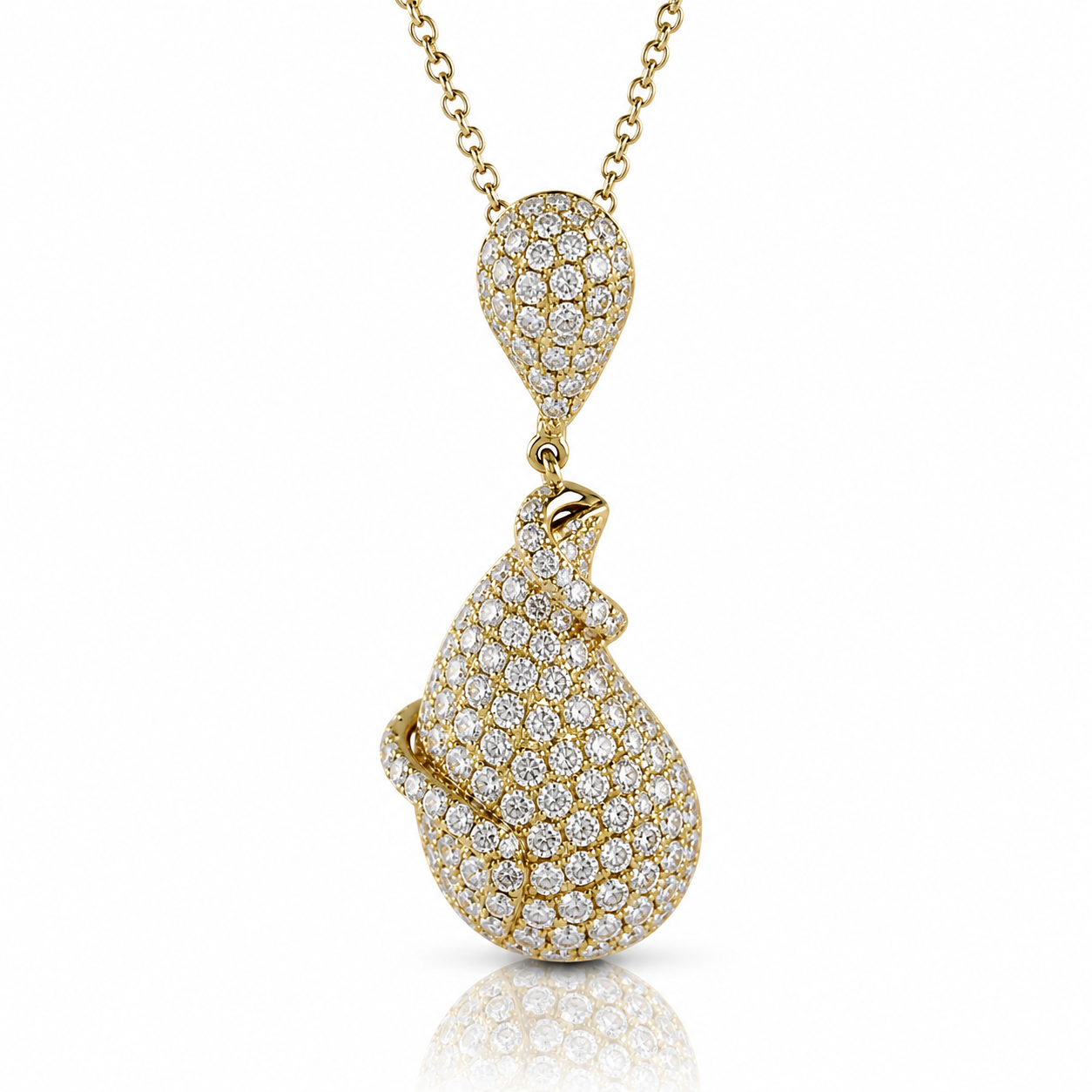 A gold-colored necklace with a pendant featuring a large, intricately designed crystal or gemstone.