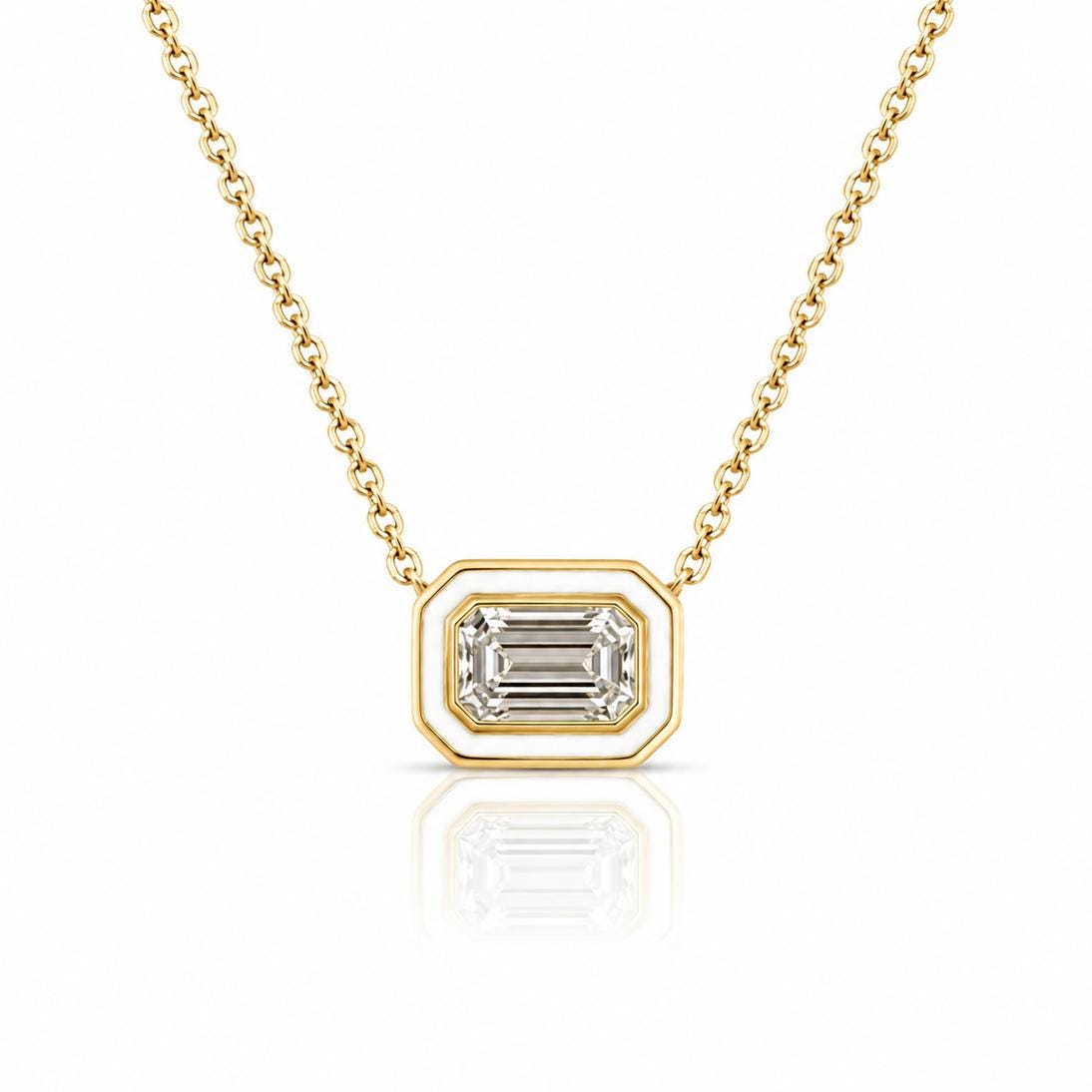 A gold necklace with a large, clear gemstone pendant in the center.