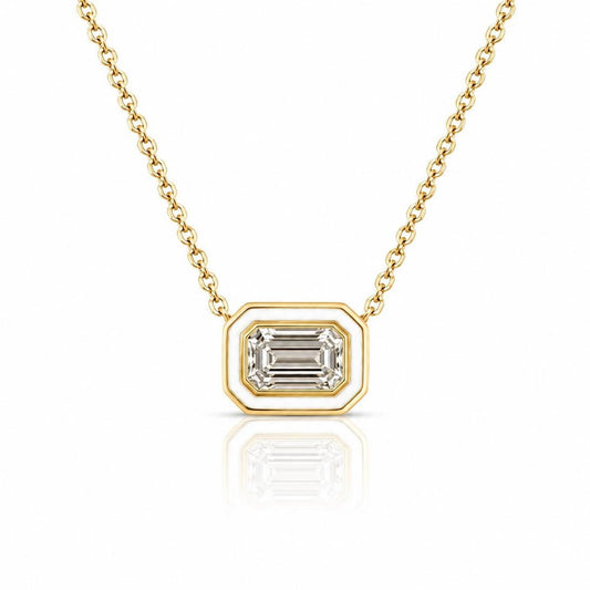 A gold necklace with a large, clear gemstone pendant in the center.