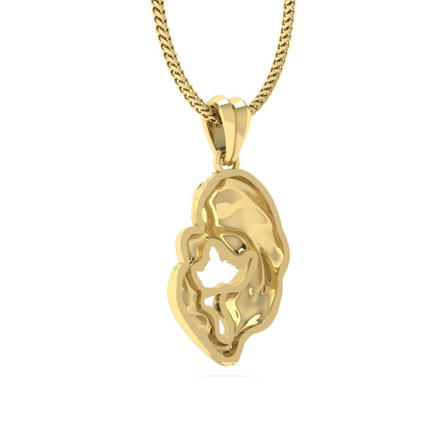 A gold-colored pendant with an abstract, organic shape resembling a flower or leaf.
