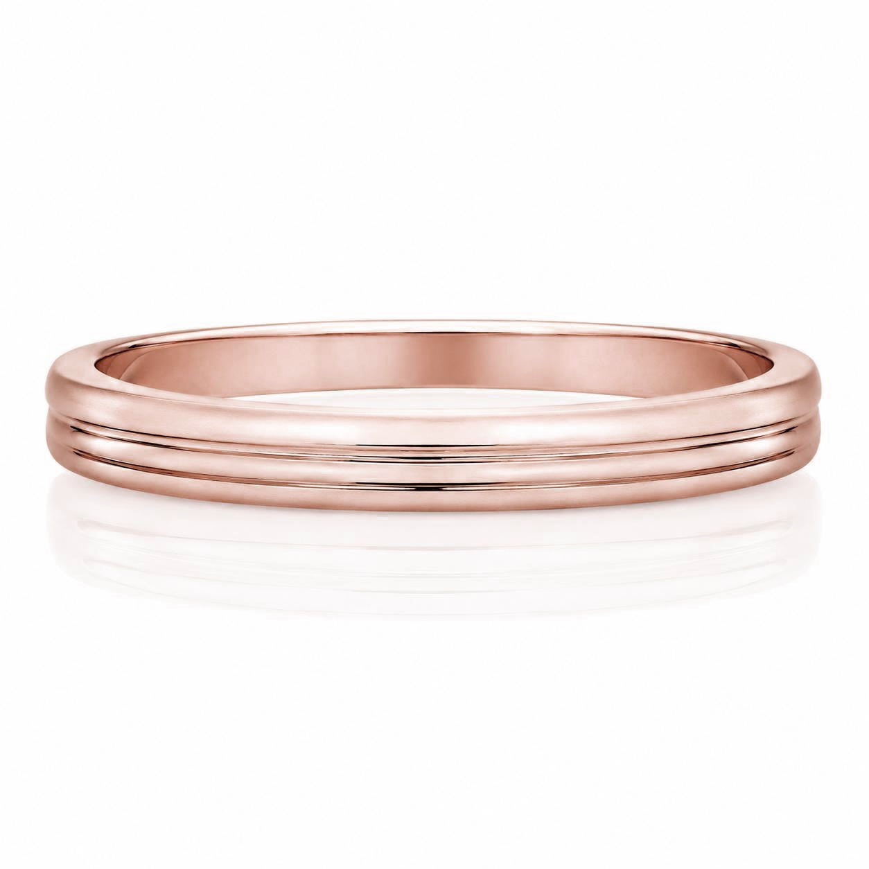 A rose gold ring with a simple, elegant design.