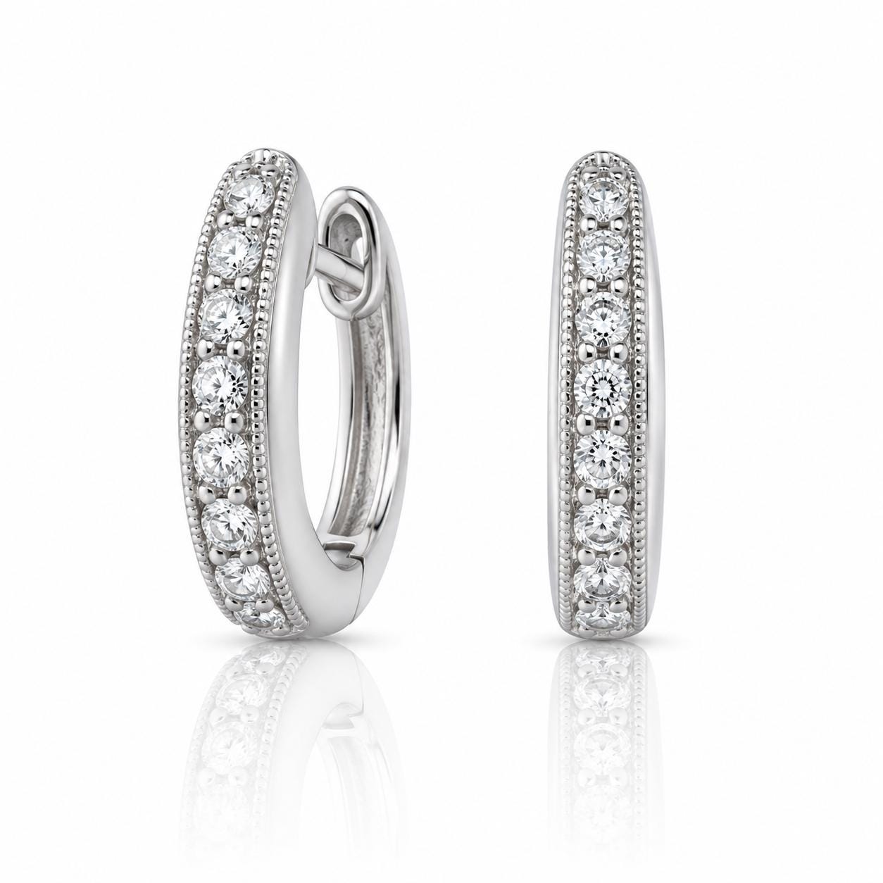 A pair of elegant silver earrings adorned with sparkling diamonds.