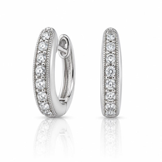 A pair of elegant silver earrings adorned with sparkling diamonds.