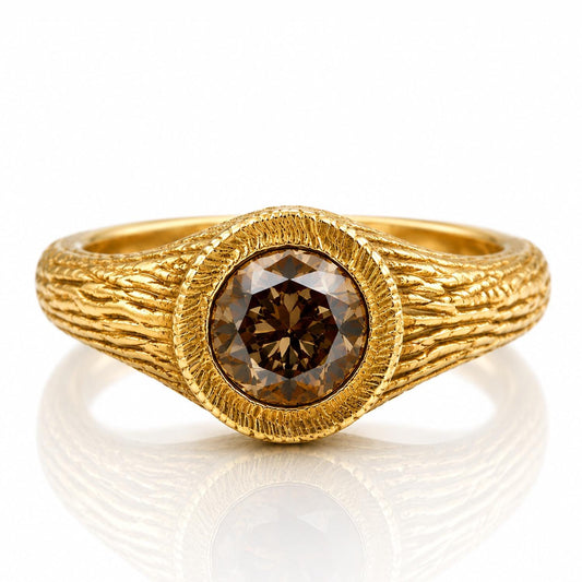 A gold ring with a large, round diamond in the center.