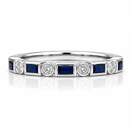 A silver ring with a row of blue and white gemstones set in it.