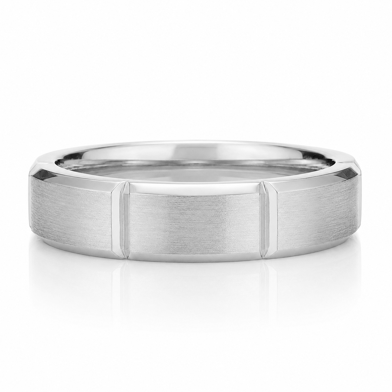 A silver-colored ring with a textured band design.
