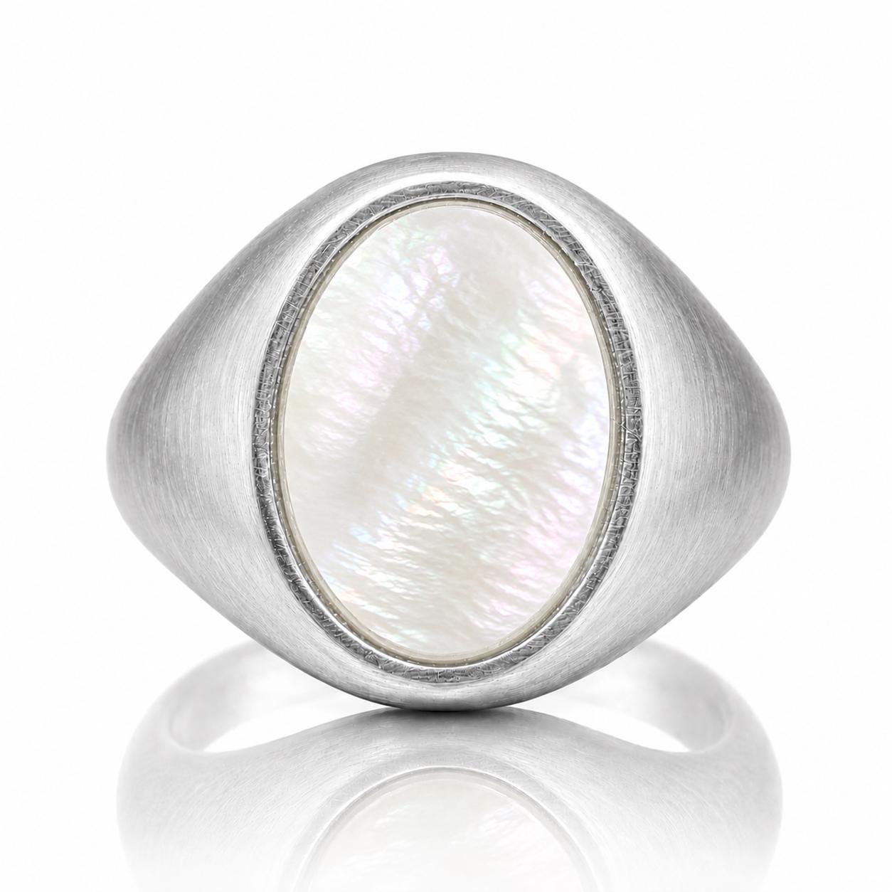 A silver ring with a large oval-shaped pearl in the center.