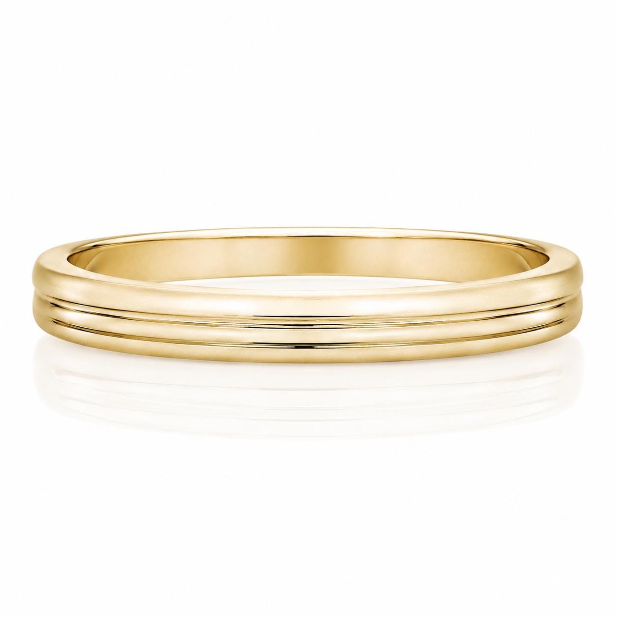 A gold ring with a simple, elegant design.