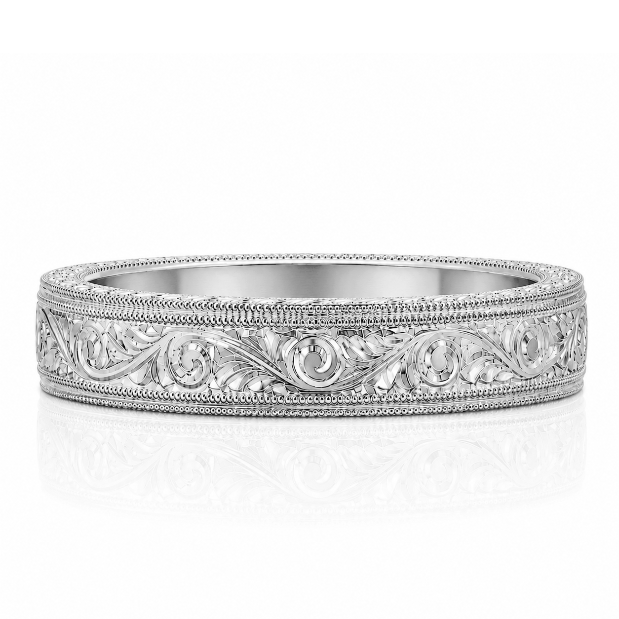A silver-colored ornate ring with intricate designs and patterns.