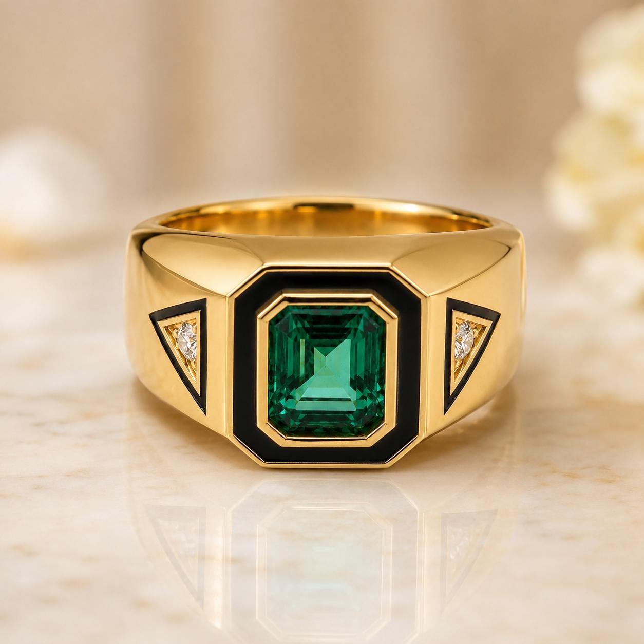 A gold ring with a large green gemstone in the center, surrounded by smaller diamonds on either side.